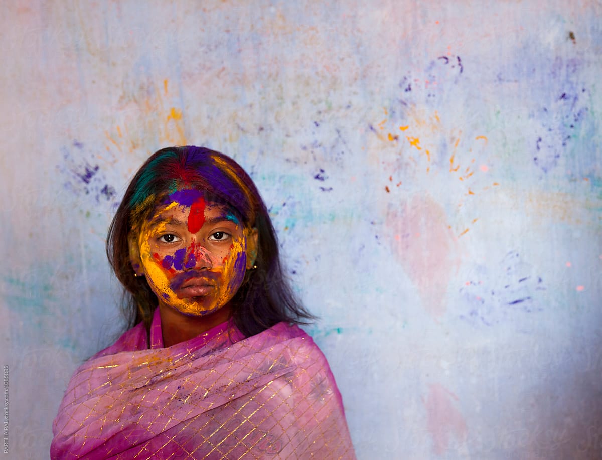 Bengali girl with color powder in her face