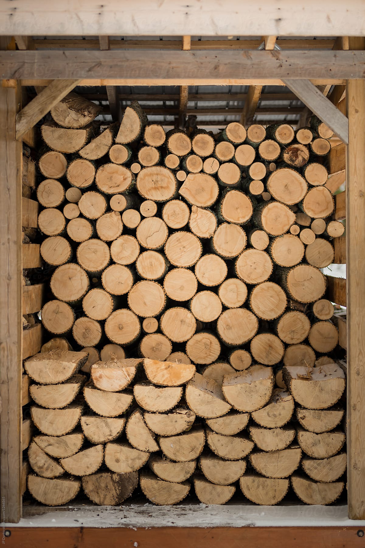 Crib of Stacked Firewood At Cottage Winter Wood Pile