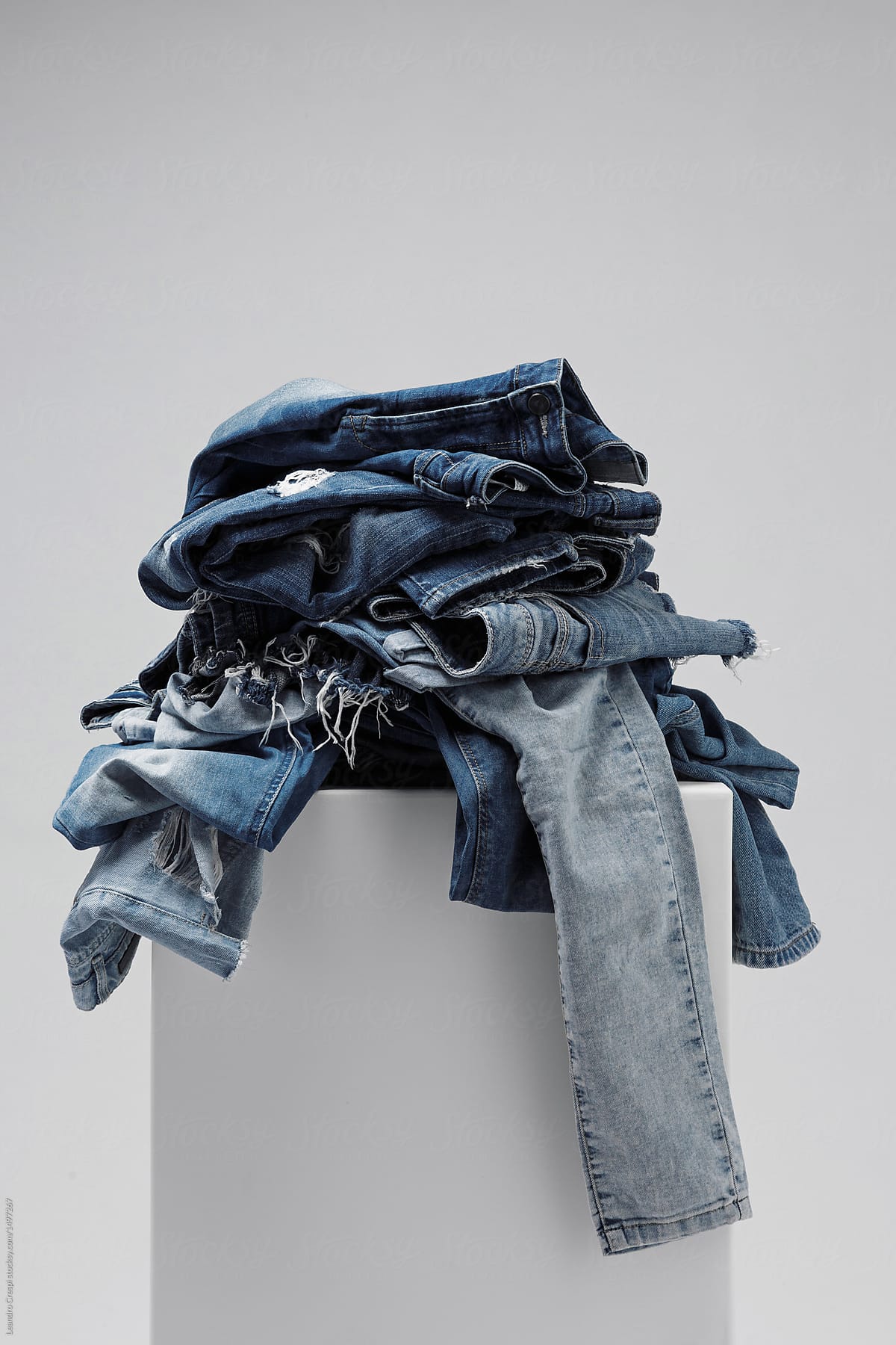 a pile of blue jeans