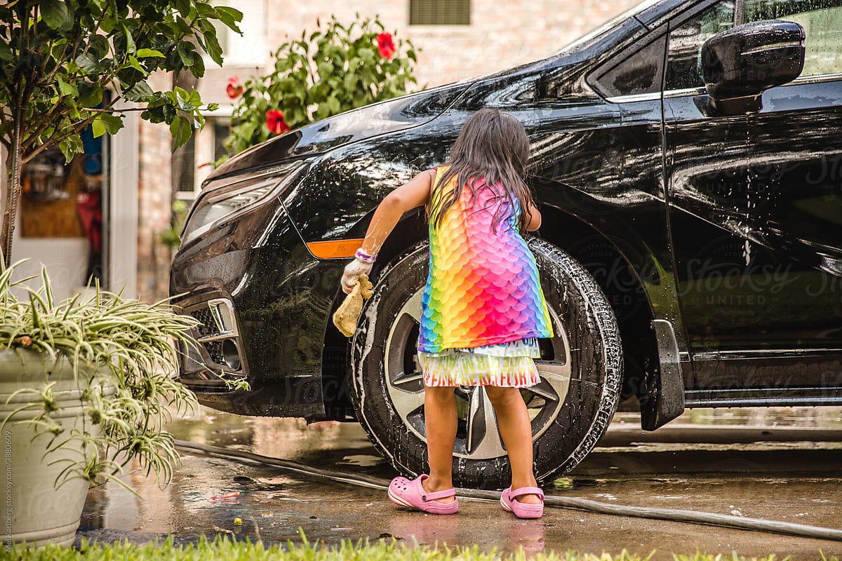 Girl washing a car