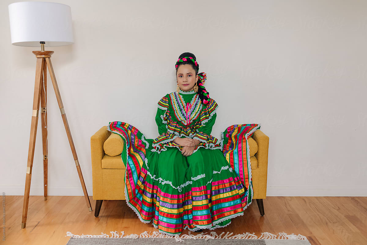 Girl dressed up in traditional Mexican dress and braid