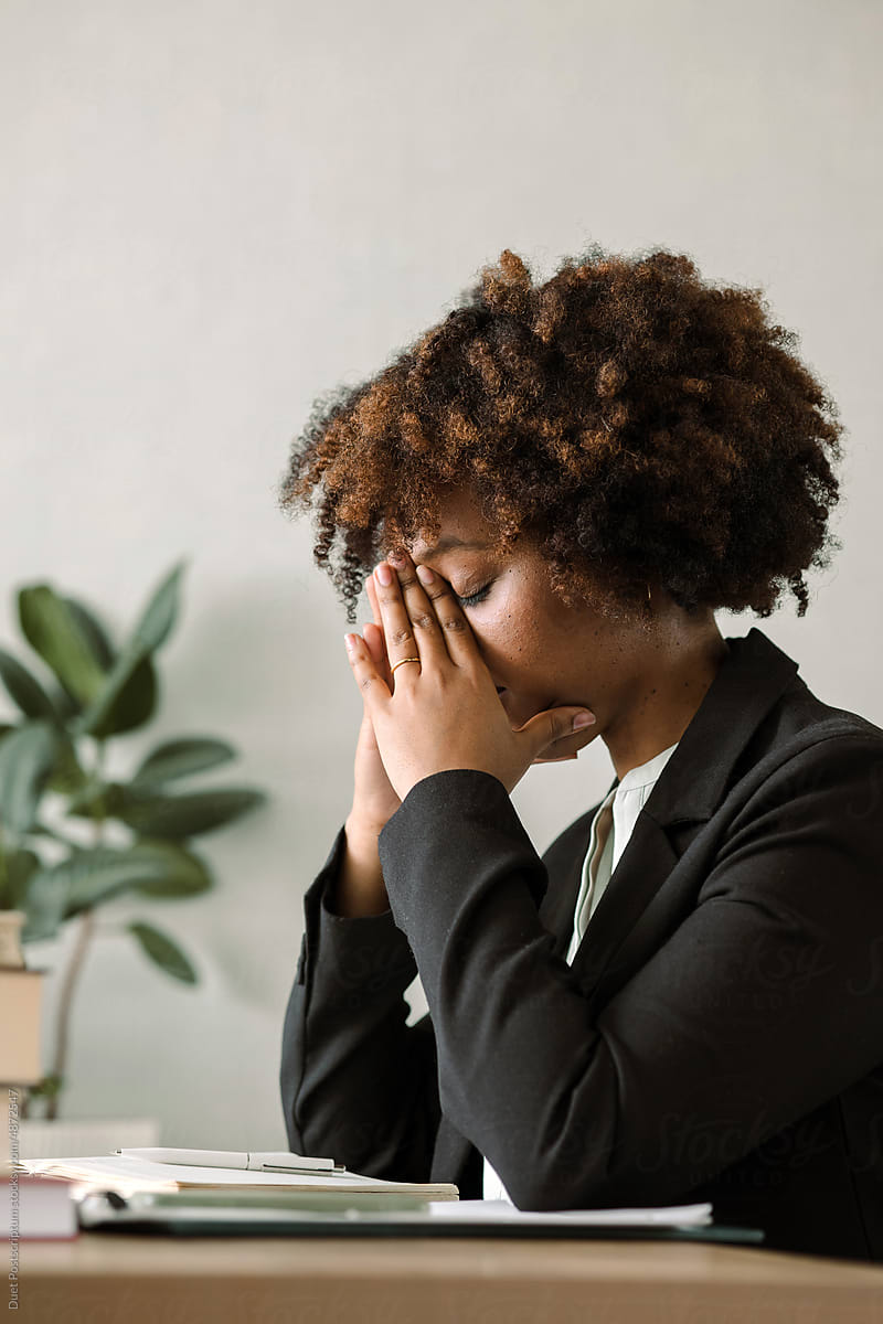 Black young woman tired from work process.