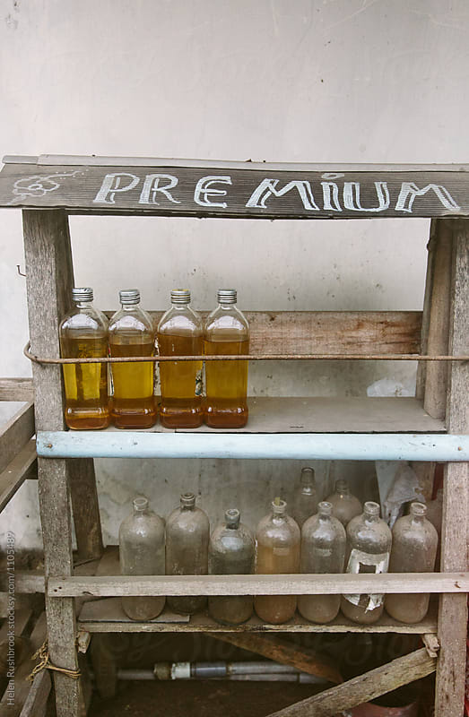 Petrol in glass bottles for sale at a village store in Bali