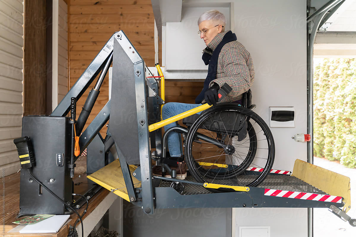 Woman With Disability Using Wheelchair Lift