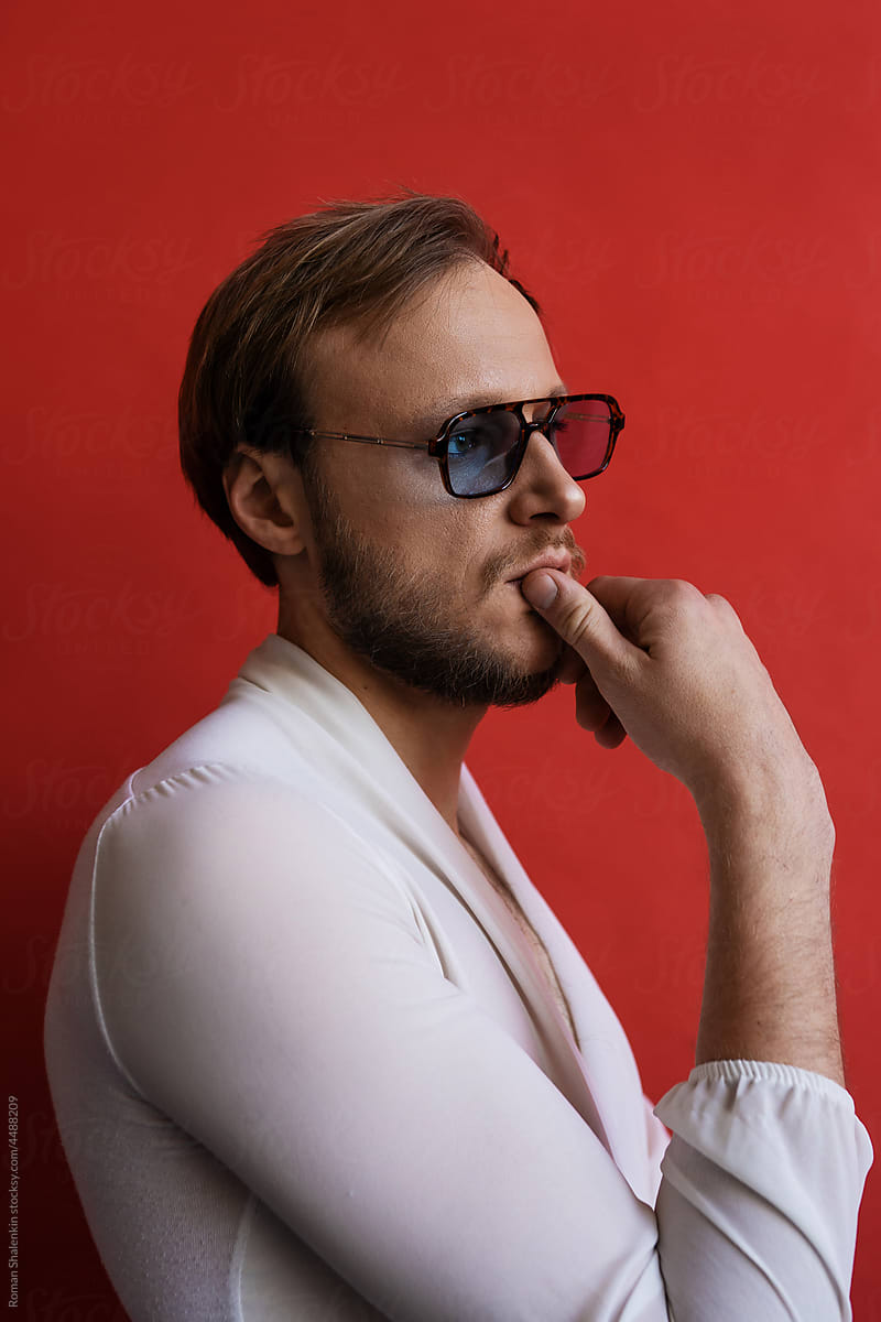 Portrait of Man in retro fashion glasses looking away