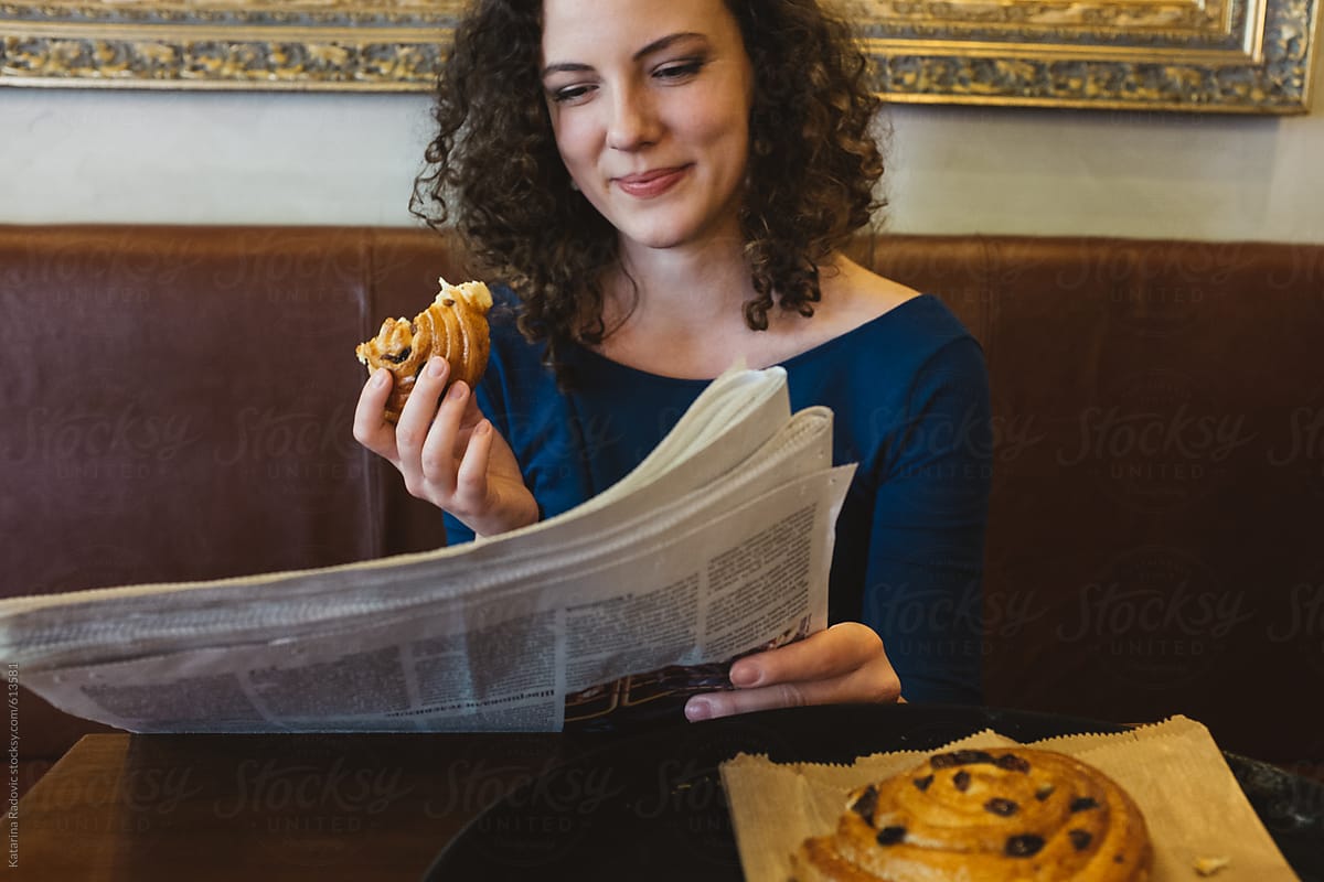 Beautiful Woman Having Breakfast And Reading Newspapers By Stocksy Contributor Katarina 