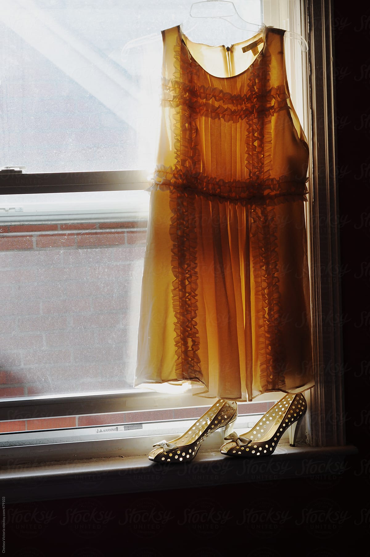 Dress and shoes on a window