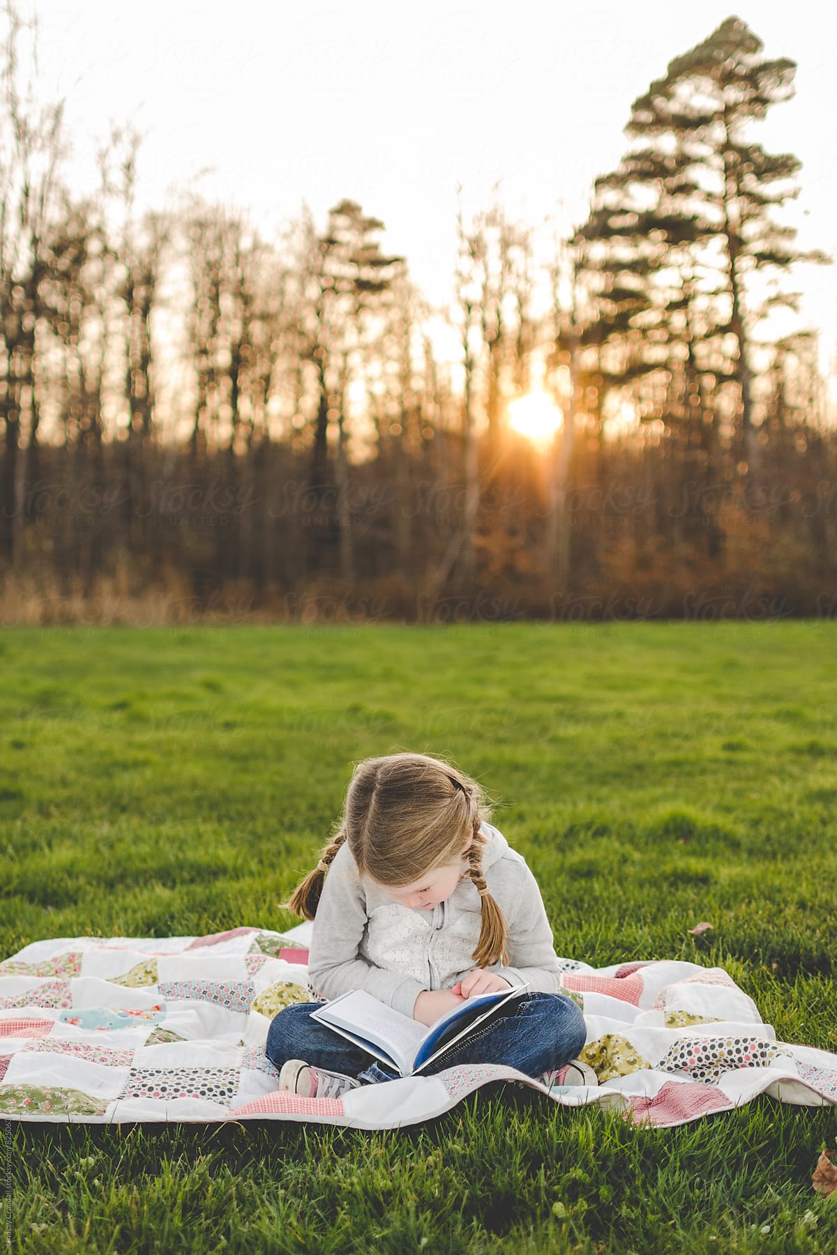 Girl reading in a field