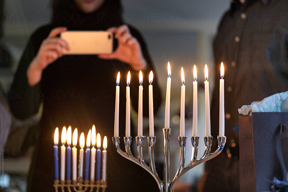 Hanukkah: Teen Girl Takes A Photo Of Menorah With Cell Phone