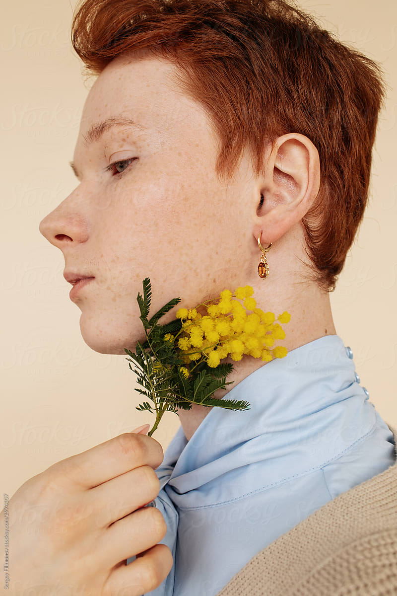 Ginger man touched with yellow flower