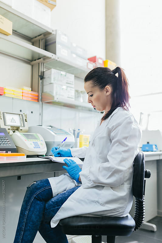 Young Scientist Woman Working in a Professional Laboratory