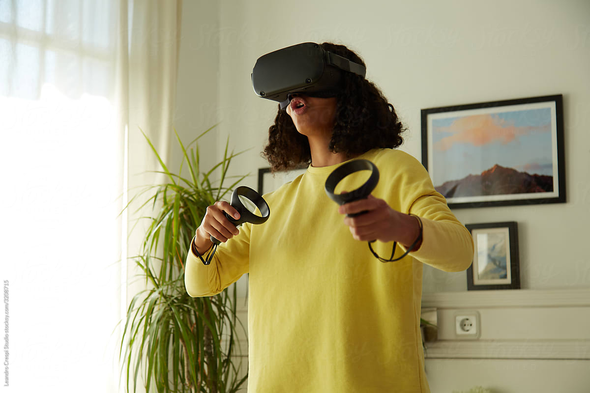 Mixed race woman playing in VR