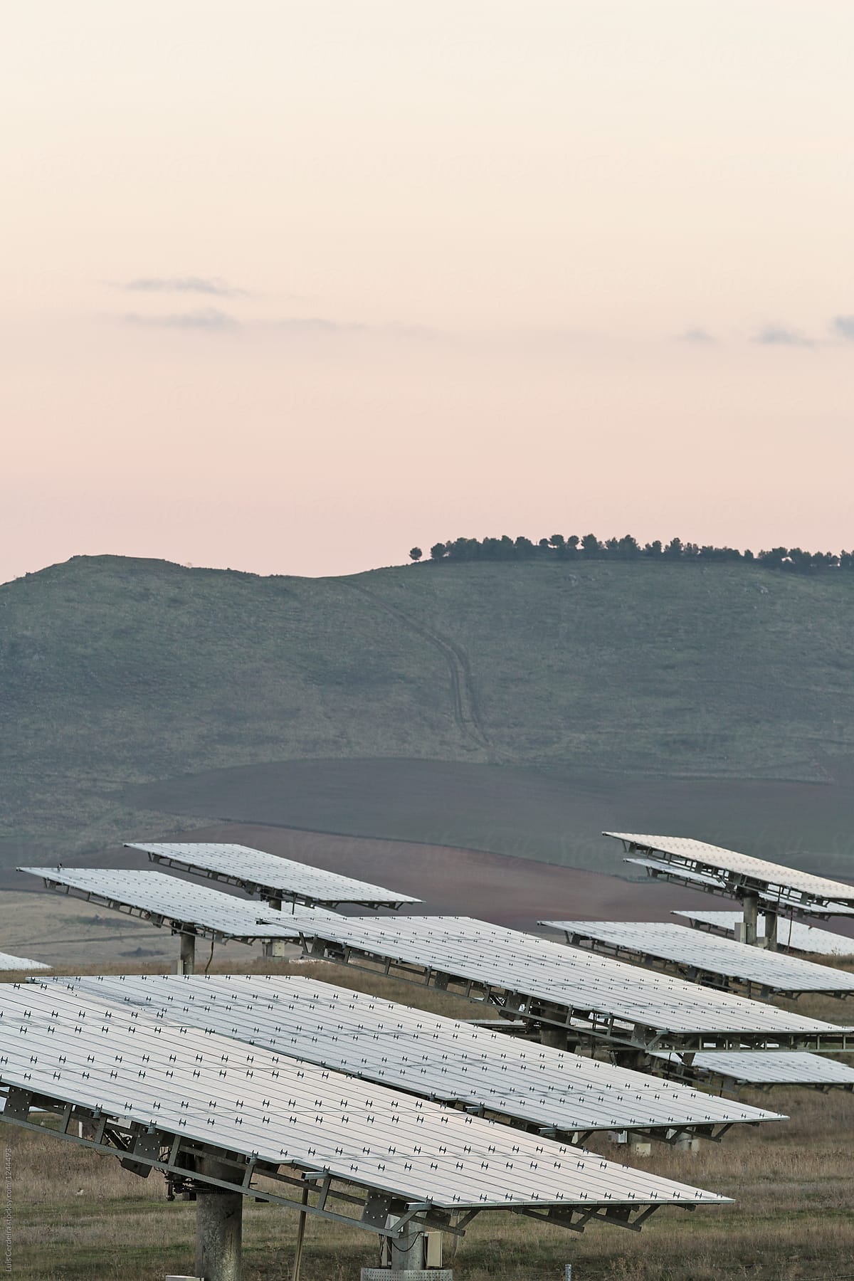 Solar panels in countryside at dusk