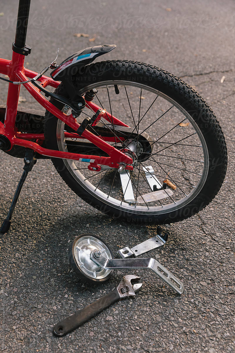 Training Wheels and wrench on Bike with Kickstand