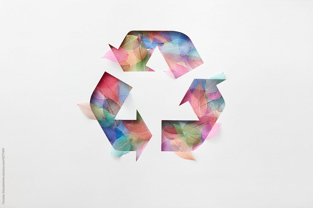 Recycle symbol made of colored leaves