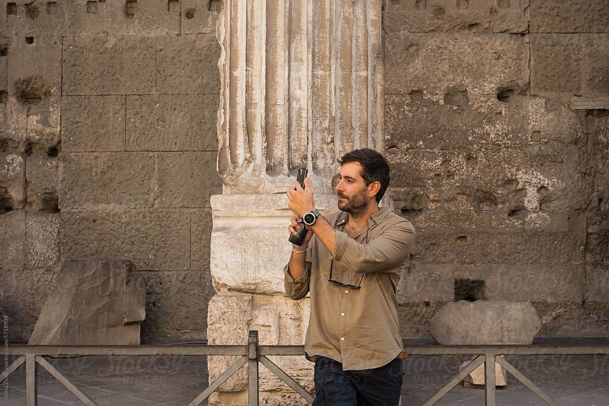 Handsome Young Man Taking Picture on Mobile Phone in Rome