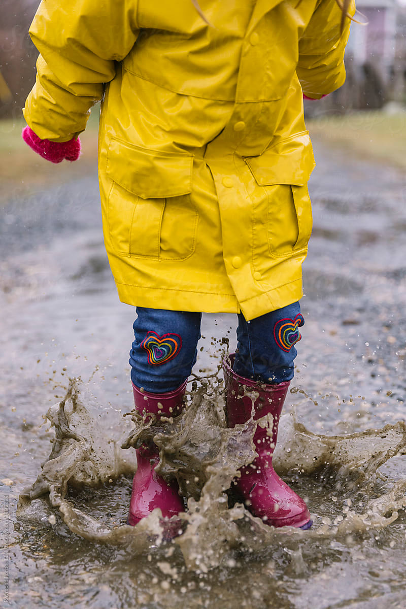 Child Jumping  in Puddle