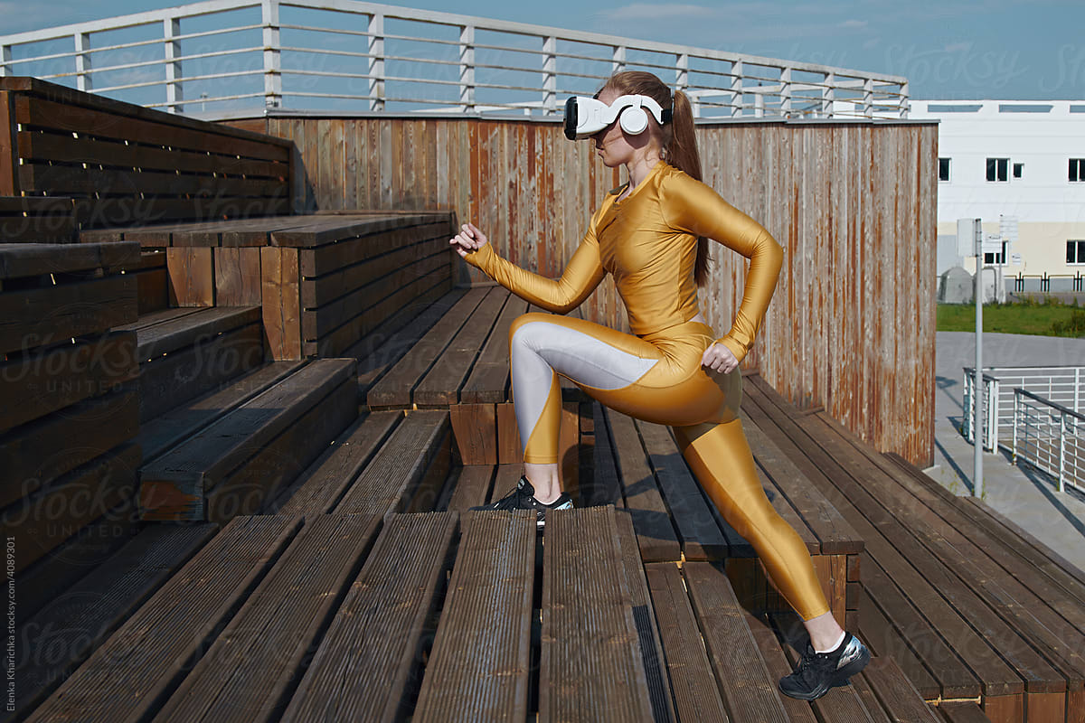 Woman exercising in virtual reality glasses