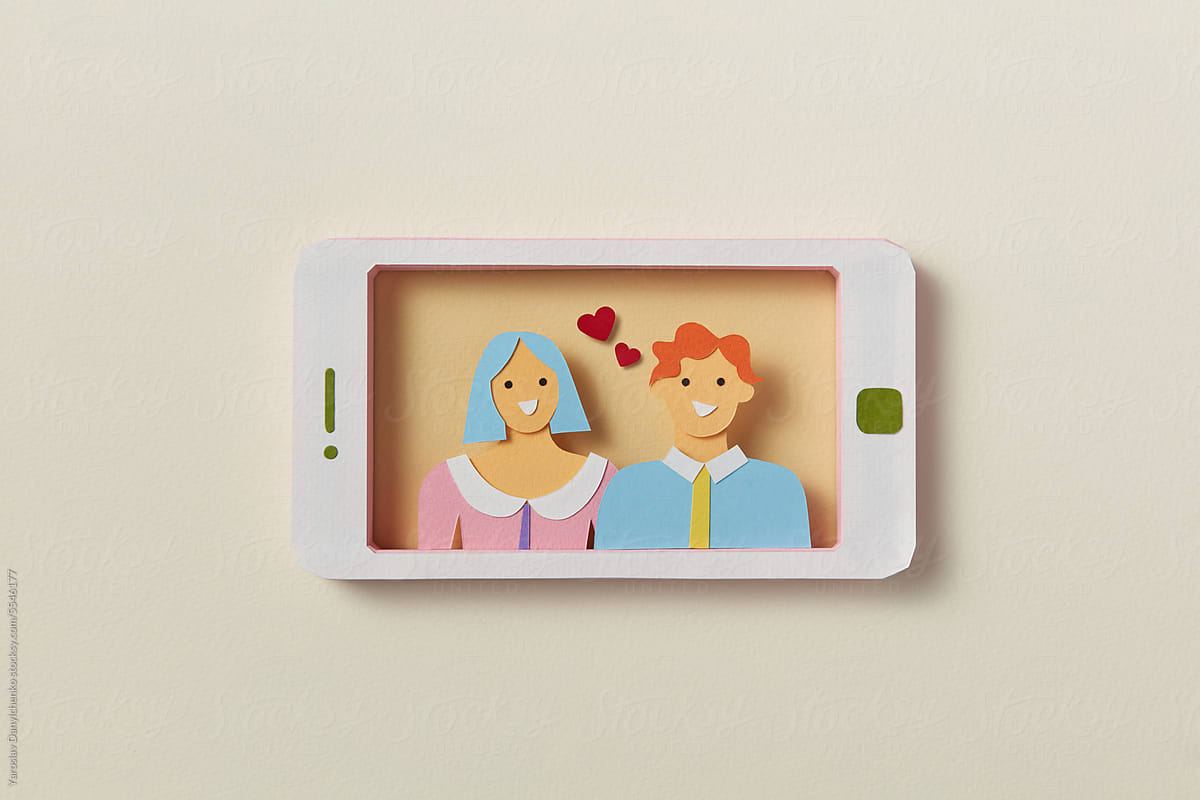 Handmade paper smartphone with video call of couple in love