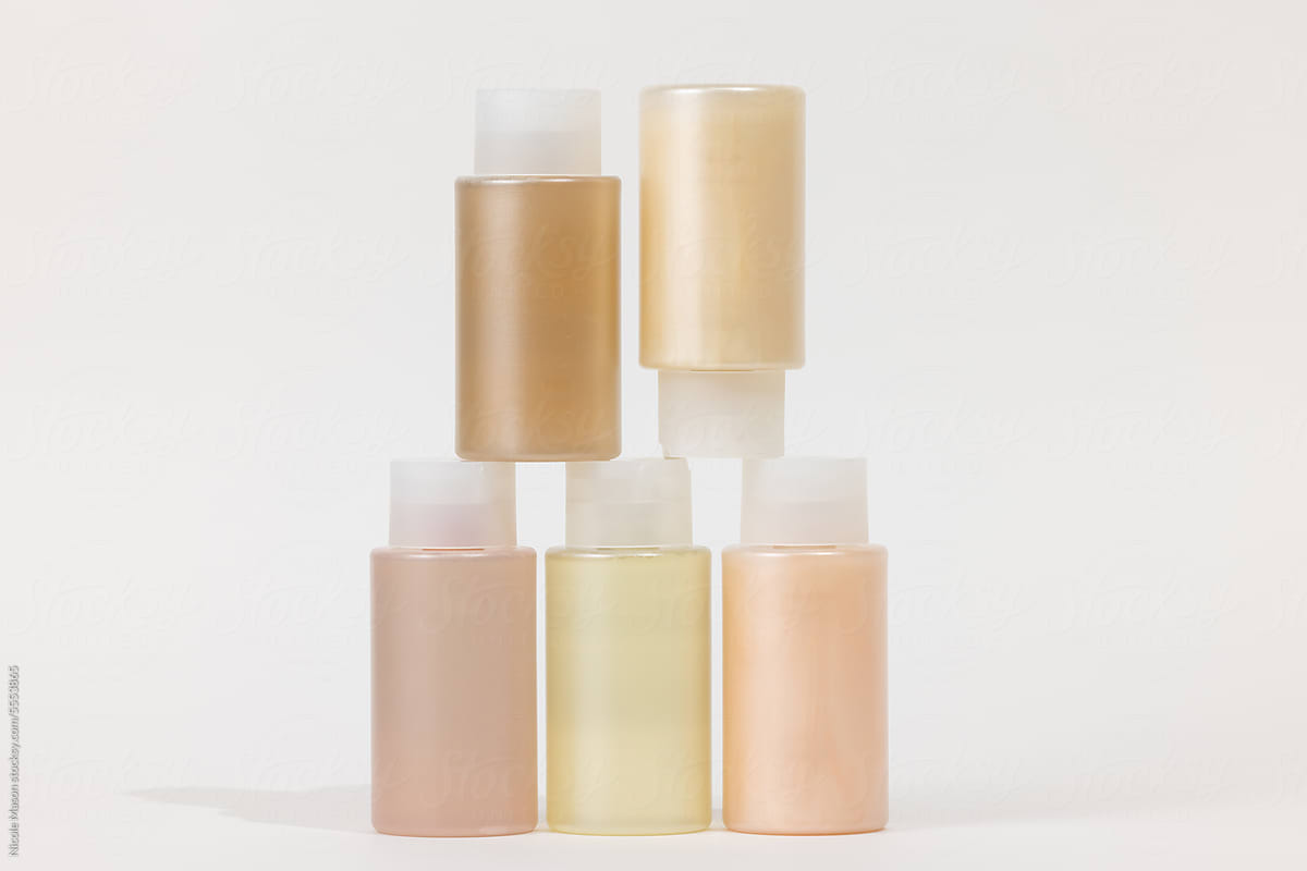stack of beauty packaging in warm pastel tones