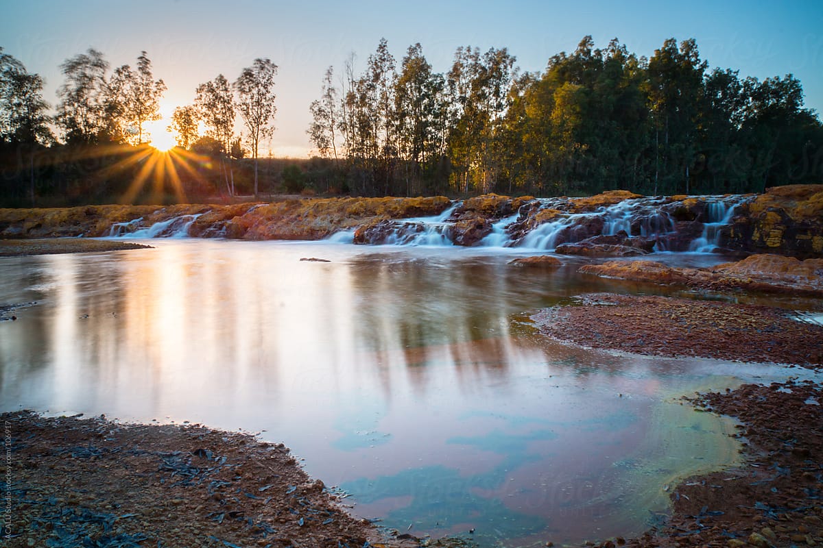 Waterfalls of a river at sunset