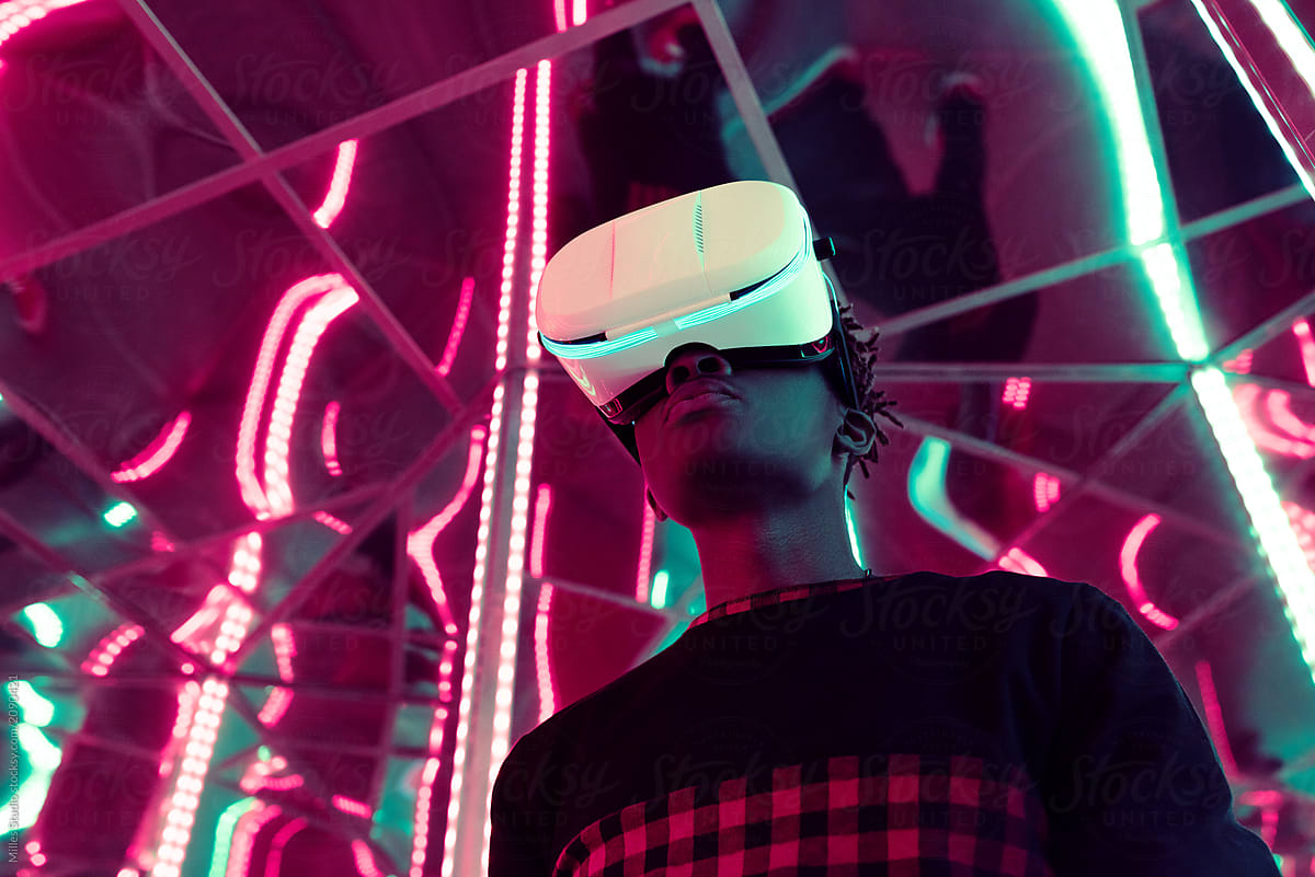 Black man in VR headset in neon
