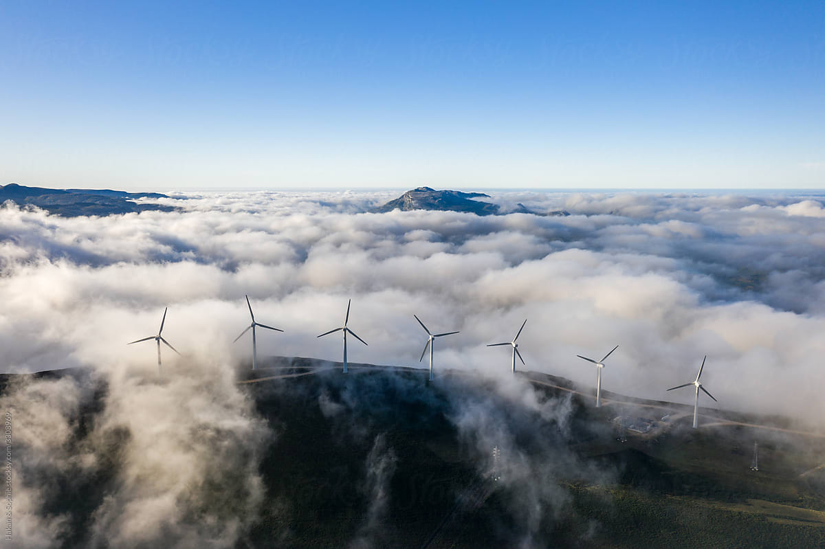 aerial view of wind generators in cloudy conditions
