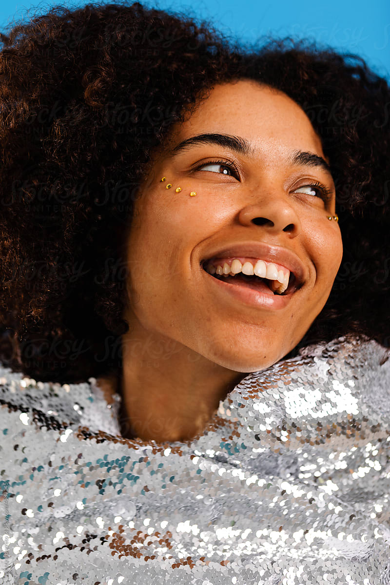 Happy latin woman with sequined clothing portrait