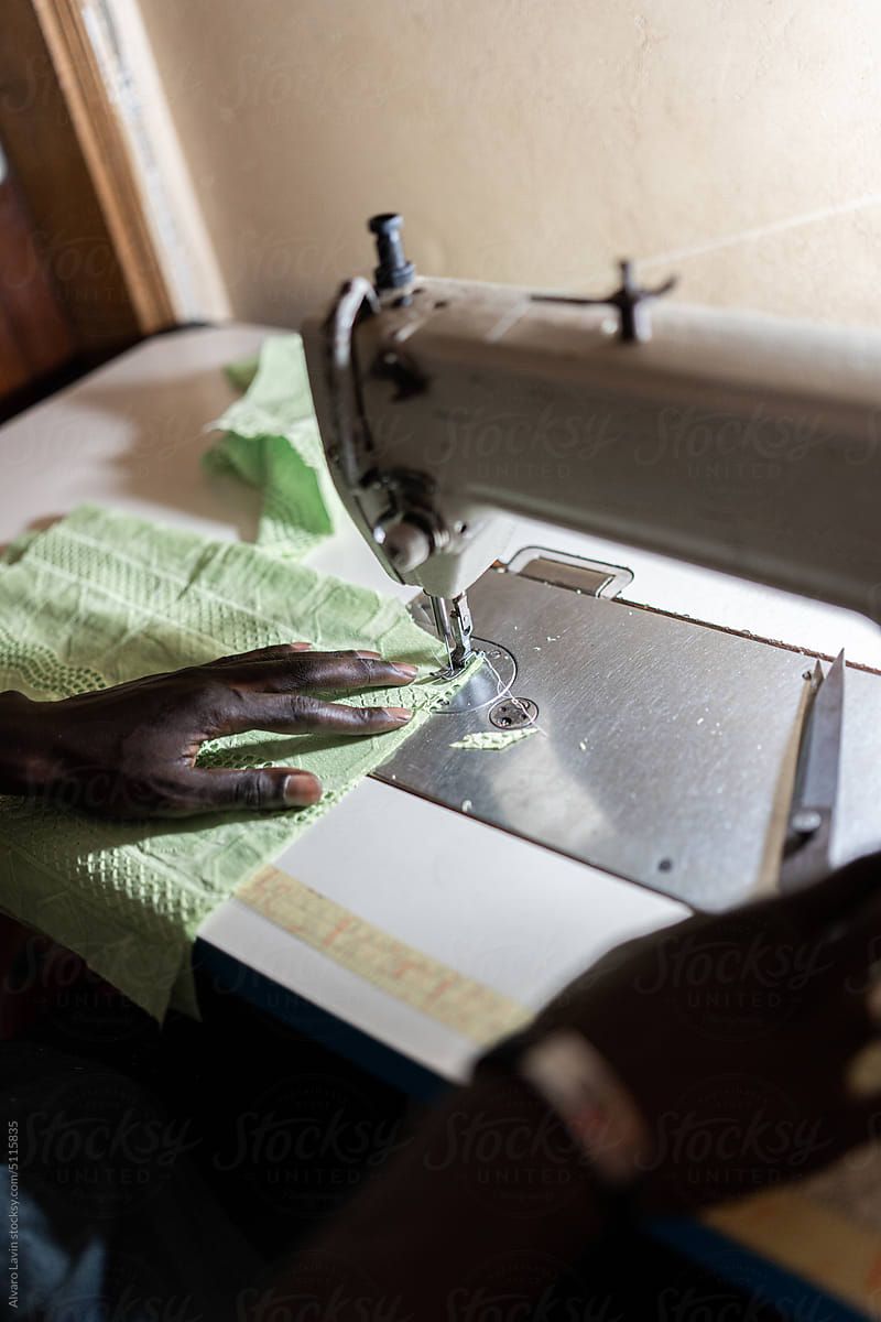 male dressmaker using sewing machine