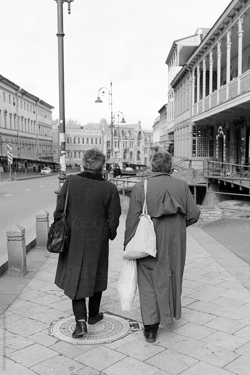 Two women in identical coats