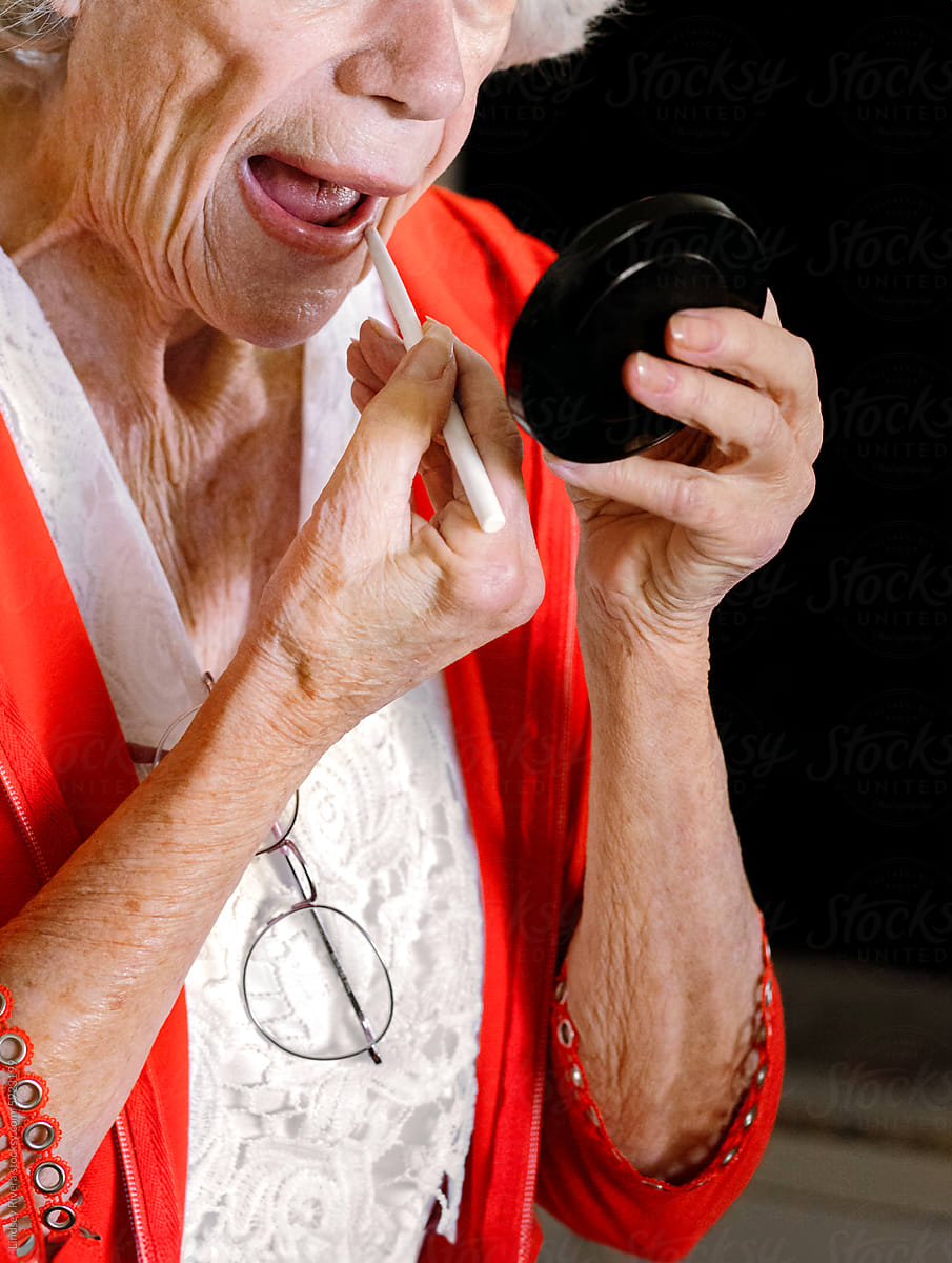 Senior Woman Touching Up Makeup