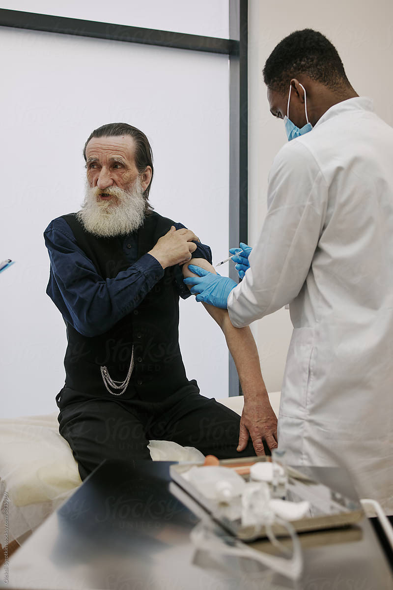 Old Man Preparing To Receive Covid-19 Vaccine