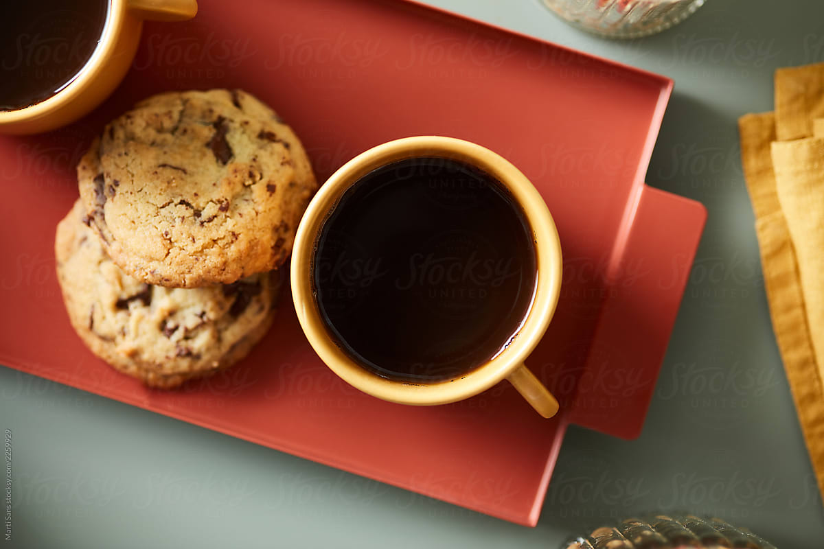 Black coffee and chocolate chip cookies.