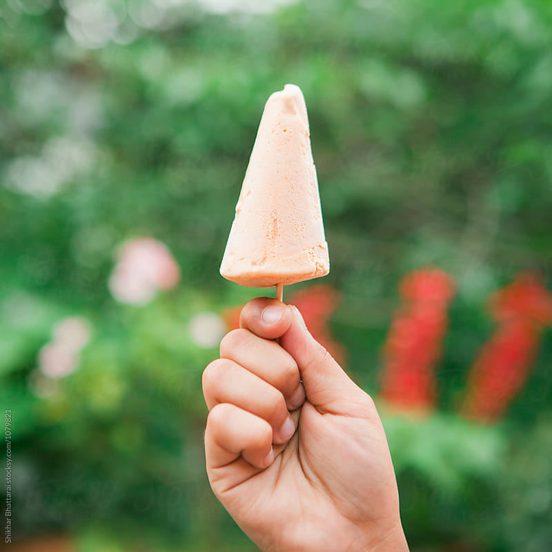 Hand holding an ice cream.