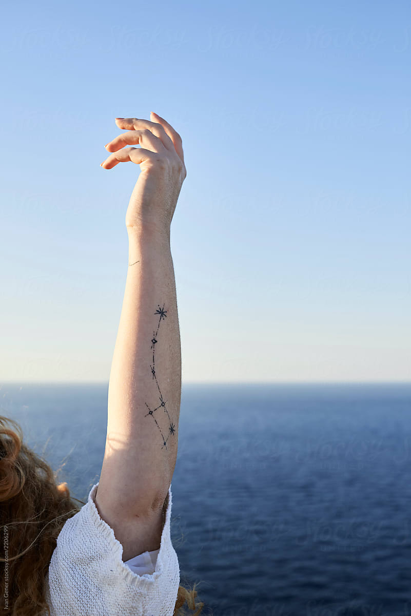 Ursa minor tattoo on female arm