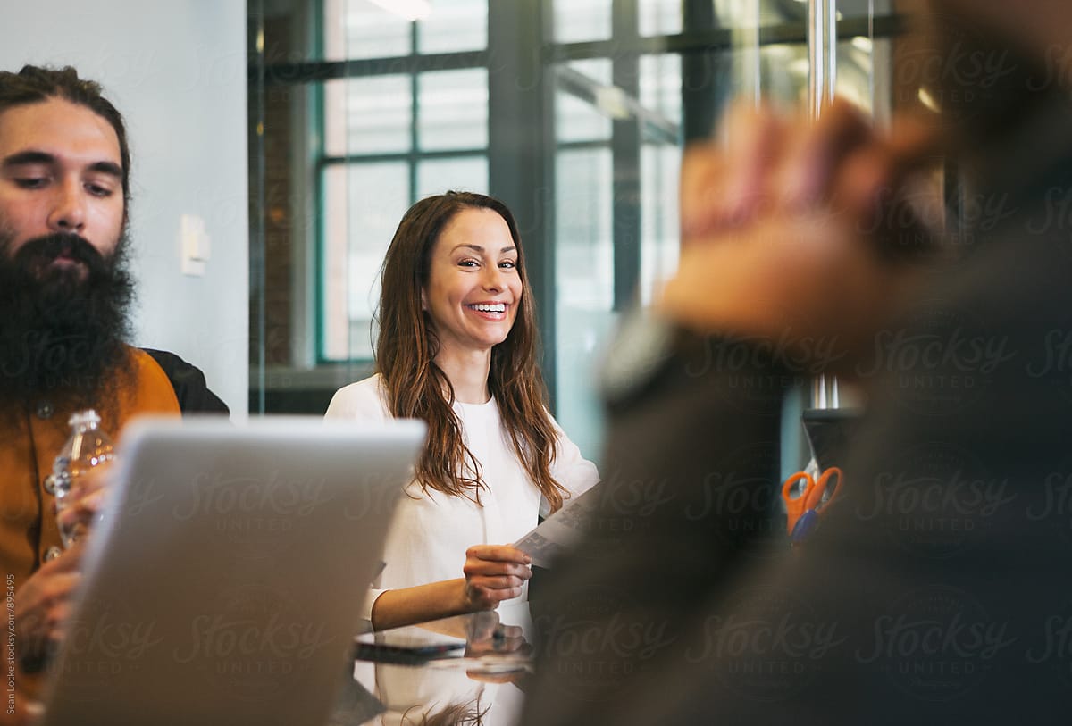 Office: Pretty Woman Laughs During Meeting In Conference Room