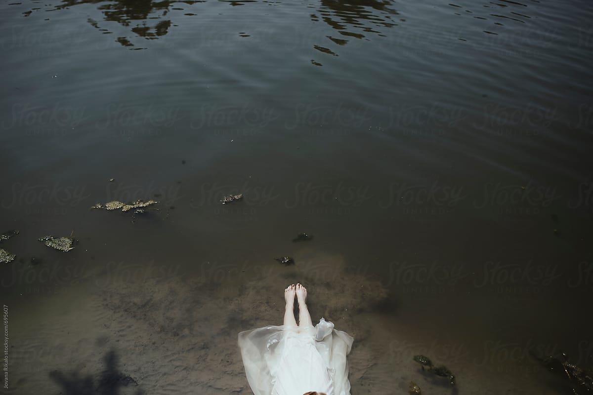 Young Woman In A White Dress Floating On Water By Stocksy Contributor