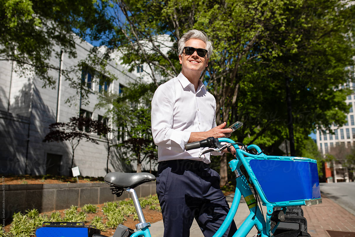 Happy Man Uses App To Rent A City Bicycle