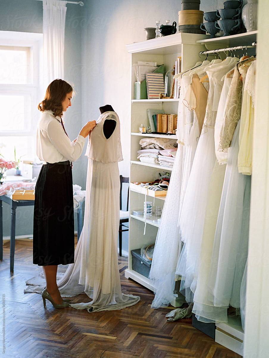 Woman sewing wedding dress