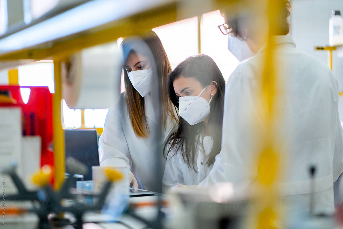 Scientist Women Colleagues Working In A Laboratory.