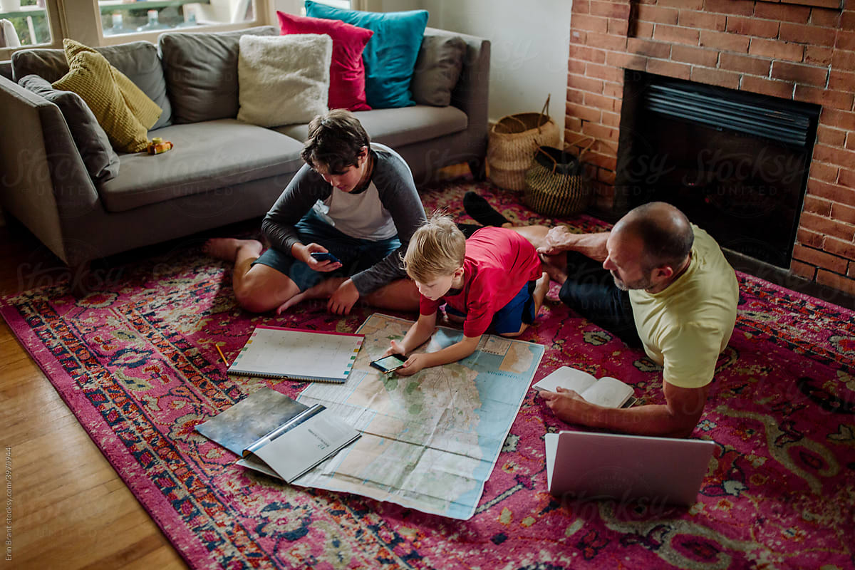 Father and sons planning trip