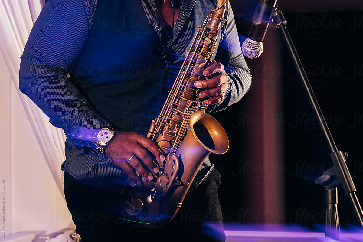 Saxophonist performing at a live music event