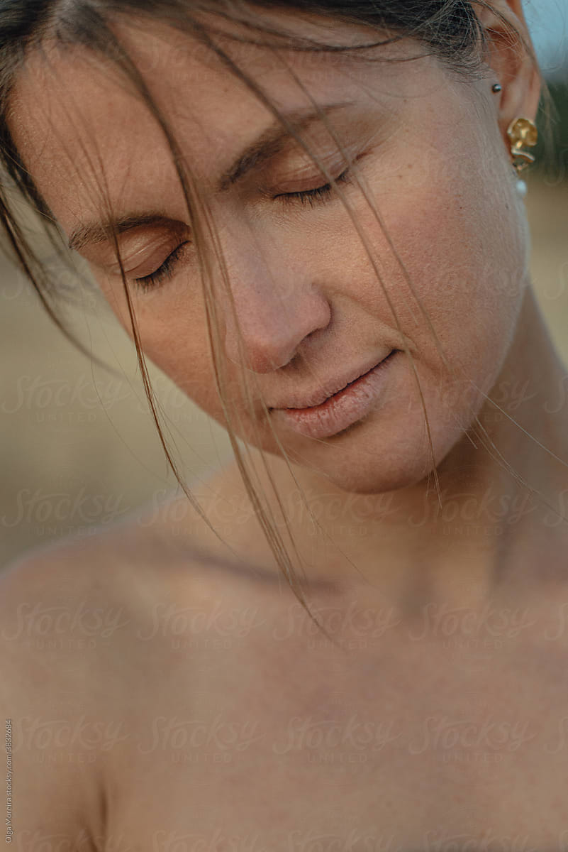 Close up portrait of a woman looking tired or sad