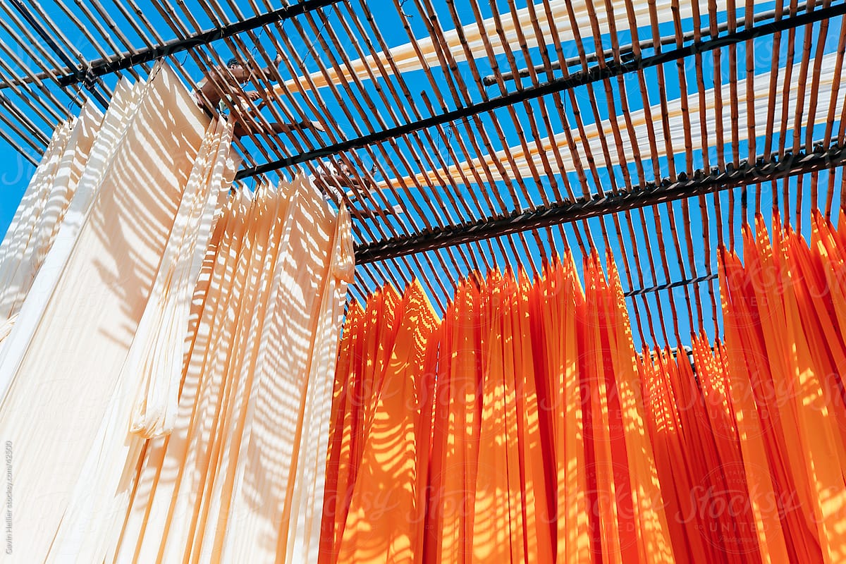 Newly dyed fabric being hung up to dry, Sari garment factory, Jaipur, Rajasthan, India