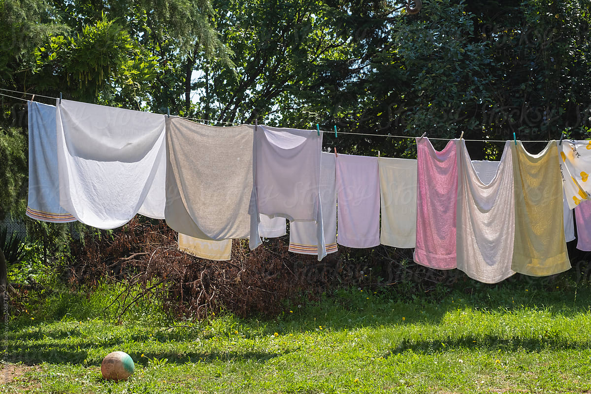 The laundry is hanging on the clothesline outdoors