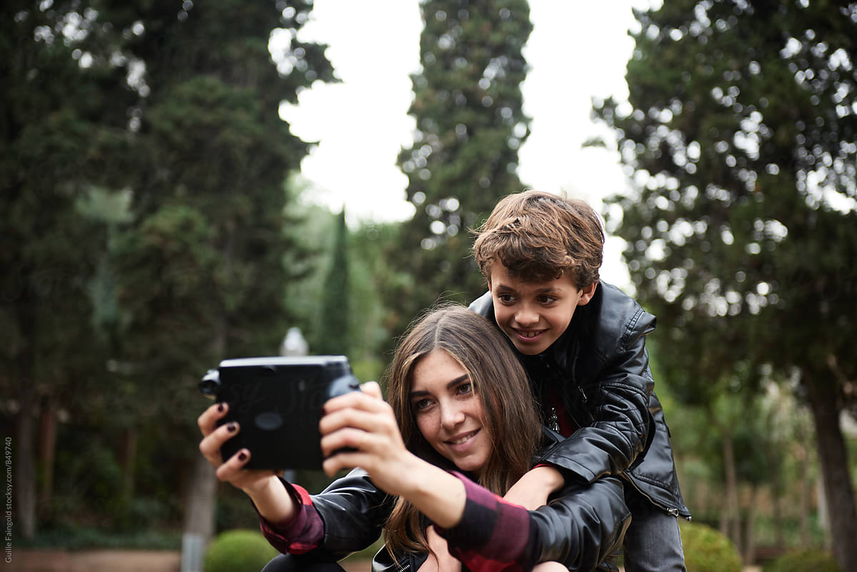 Brother and sister taking selfie