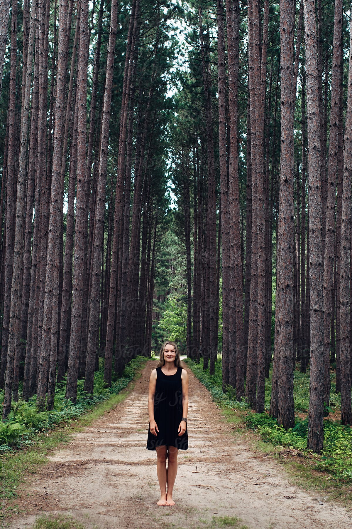 Smiling Woman In Black Dress In The Woods By Stocksy Contributor Gabi Bucataru Stocksy
