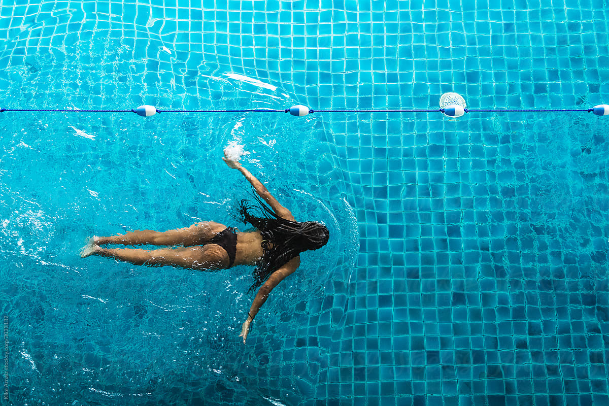 African Girl Swimming In A Swimming Pool By Kike Arnaiz