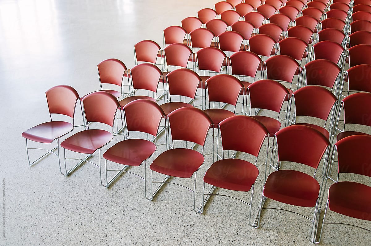 Red Chairs In a row at Business meeting Conference Center