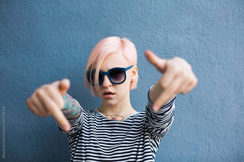 Cool woman showing middle fingers .